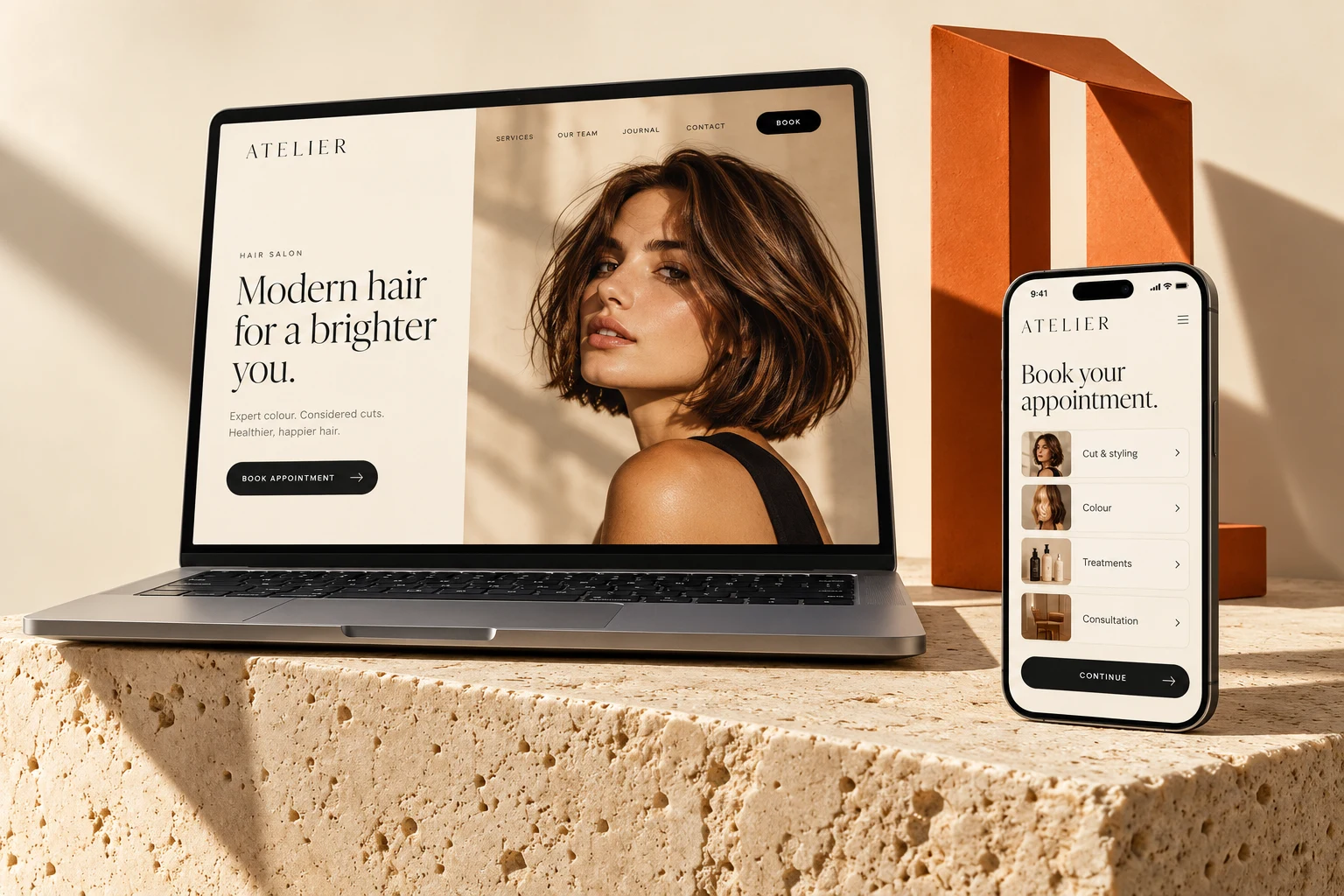 Salon website concept on a laptop and mobile phone