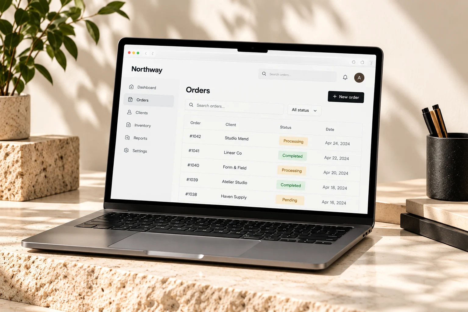 Custom software concept showing an orders dashboard on a laptop